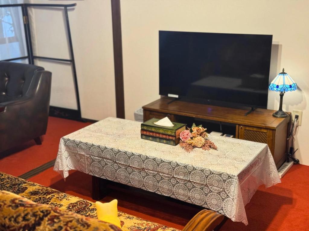 TV a/nebo společenská místnost v ubytování KANAZAWA Retro House NEKO-NOMA