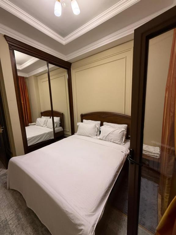 Ein Bett oder Betten in einem Zimmer der Unterkunft Tashkent city Boulevard resident 04