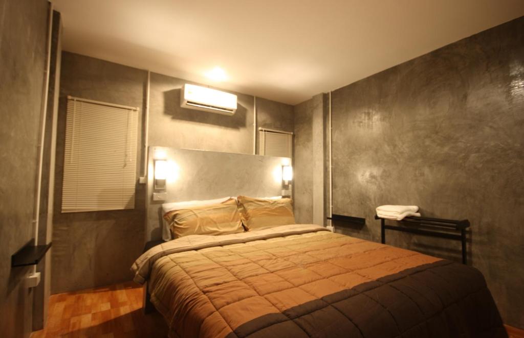 Postel nebo postele na pokoji v ubytování Aonang Lodge - SHA
