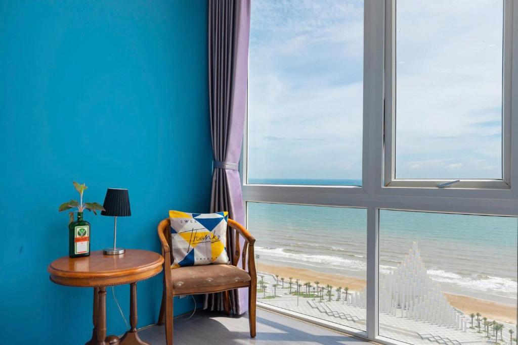 a room with a window with a view of the beach at Oasky Vũng Tàu - AnNam's Home in Vung Tau