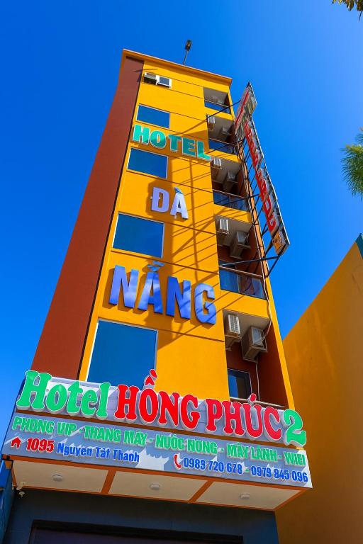 a building with a sign on the side of it at Hong Phuc Hotel 2 Da Nang in Danang