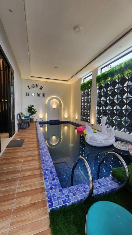 a pool in the middle of a house at Villa Yo and By in Karangploso
