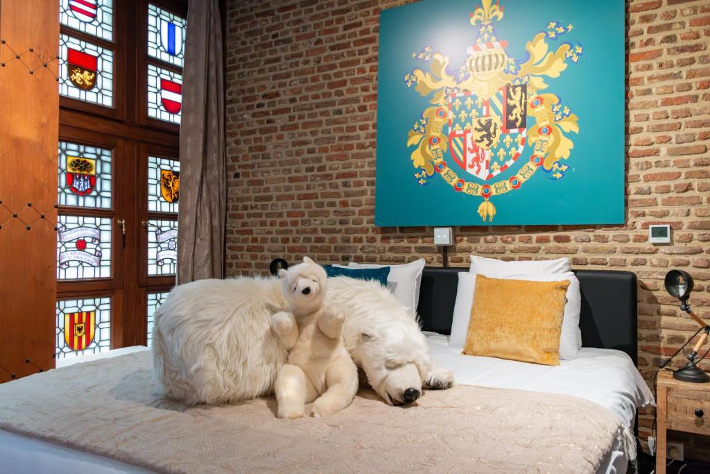 Postel nebo postele na pokoji v ubytování Charming Suites Jan Zonder Vrees