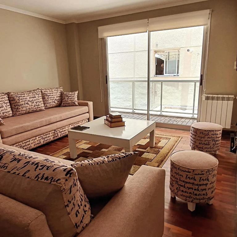 a living room with a couch and a coffee table at Caseros3 in Salta