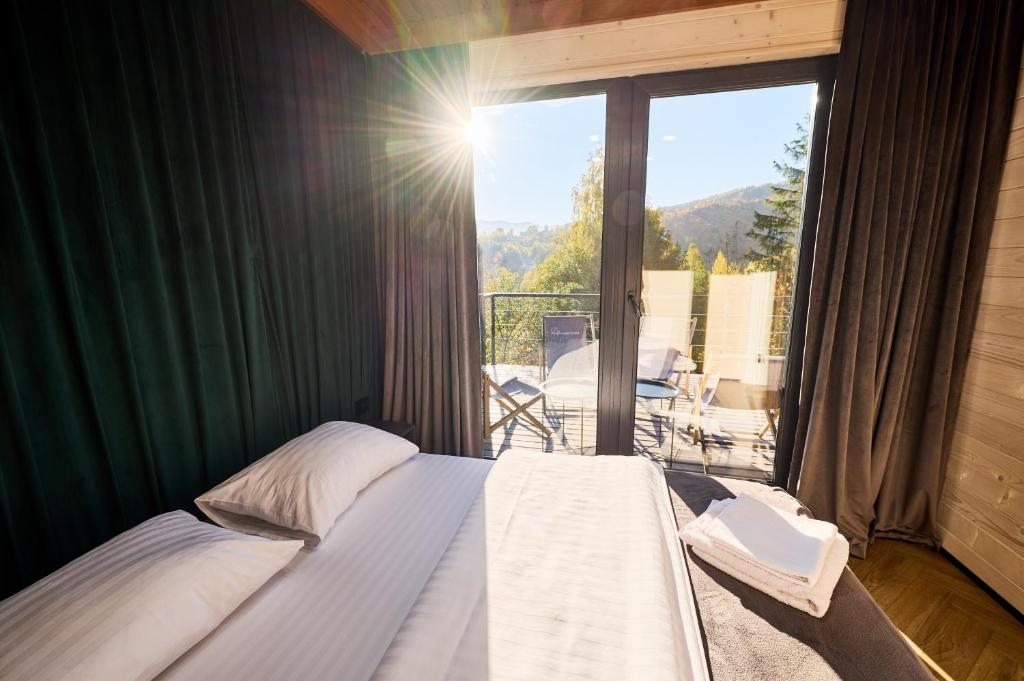 Postel nebo postele na pokoji v ubytování Blog House Resort