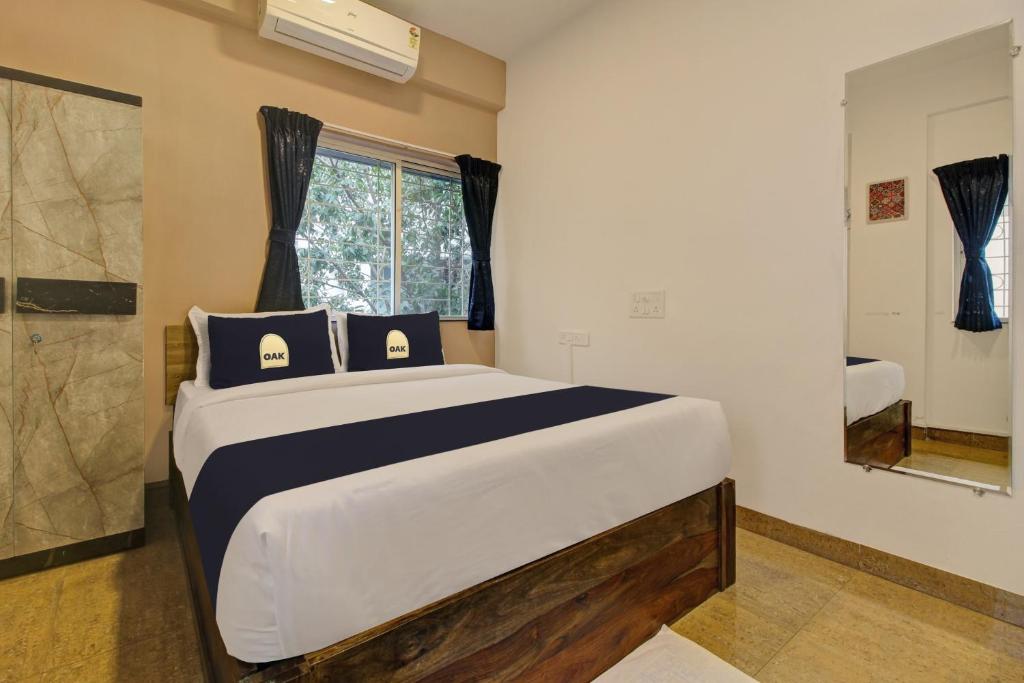 En eller flere senge i et værelse på Super Collection O Grey House