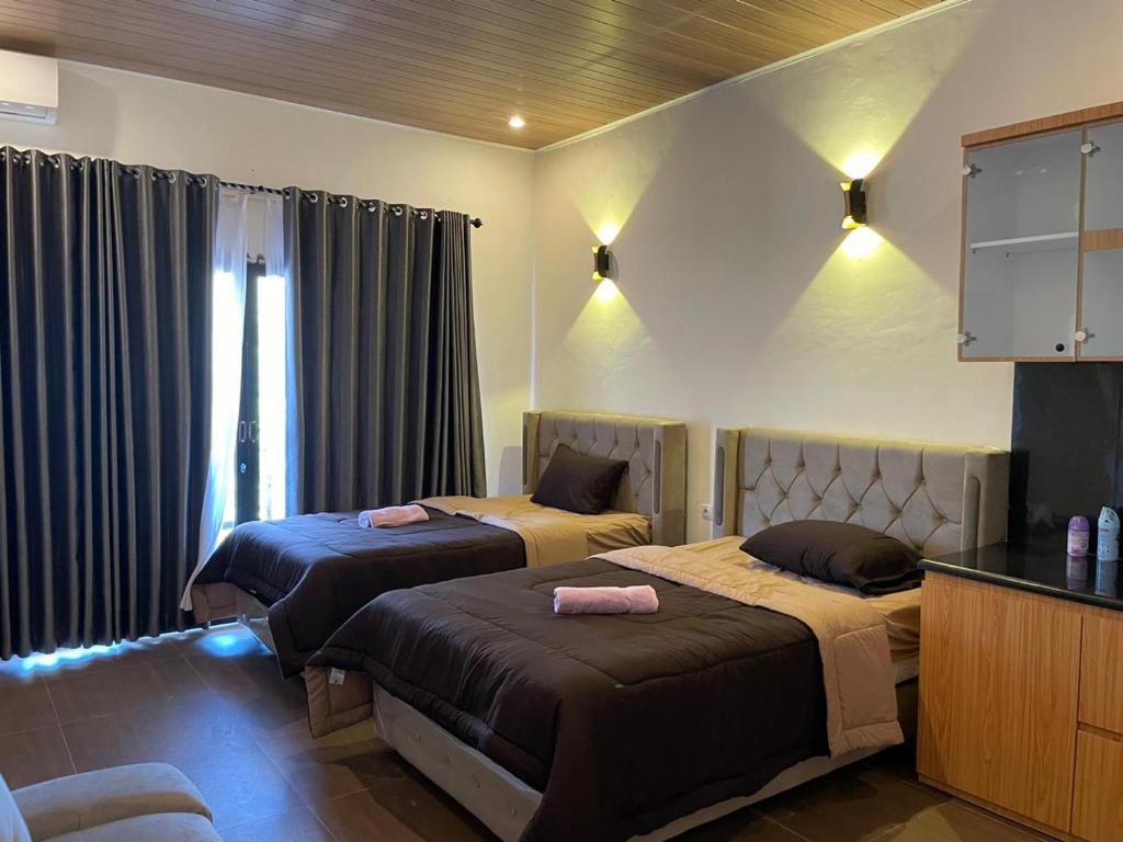 Ένα ή περισσότερα κρεβάτια σε δωμάτιο στο Sakila Guest House