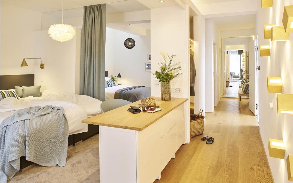 Ένα ή περισσότερα κρεβάτια σε δωμάτιο στο KönigsSCHLAF No8 - Grosse Loftwohnung in der City von Konstanz