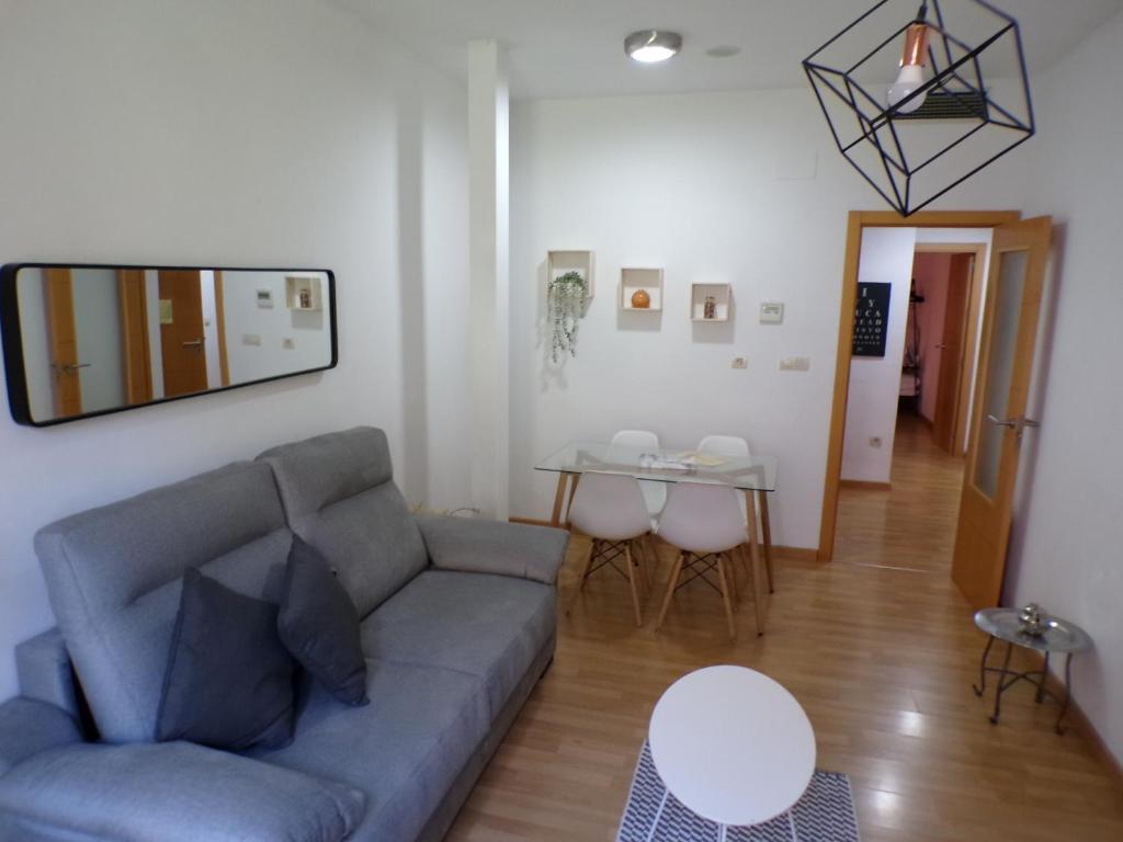 a living room with a couch and a table at Rental in the center of Granada 1B in Granada