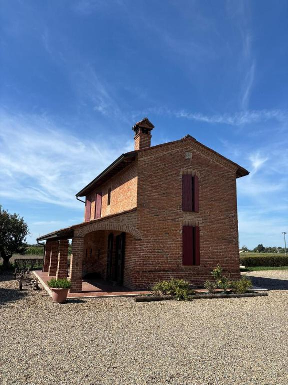 a large brick building with a tower on top at Agriturismo Varana in Zibello