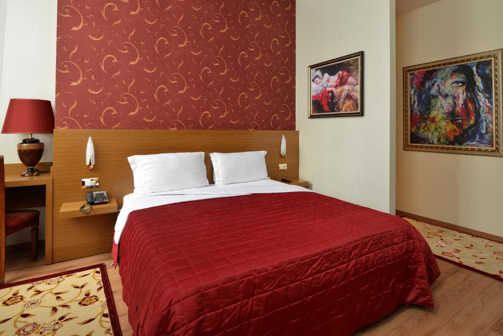Postel nebo postele na pokoji v ubytování Hotel Austria
