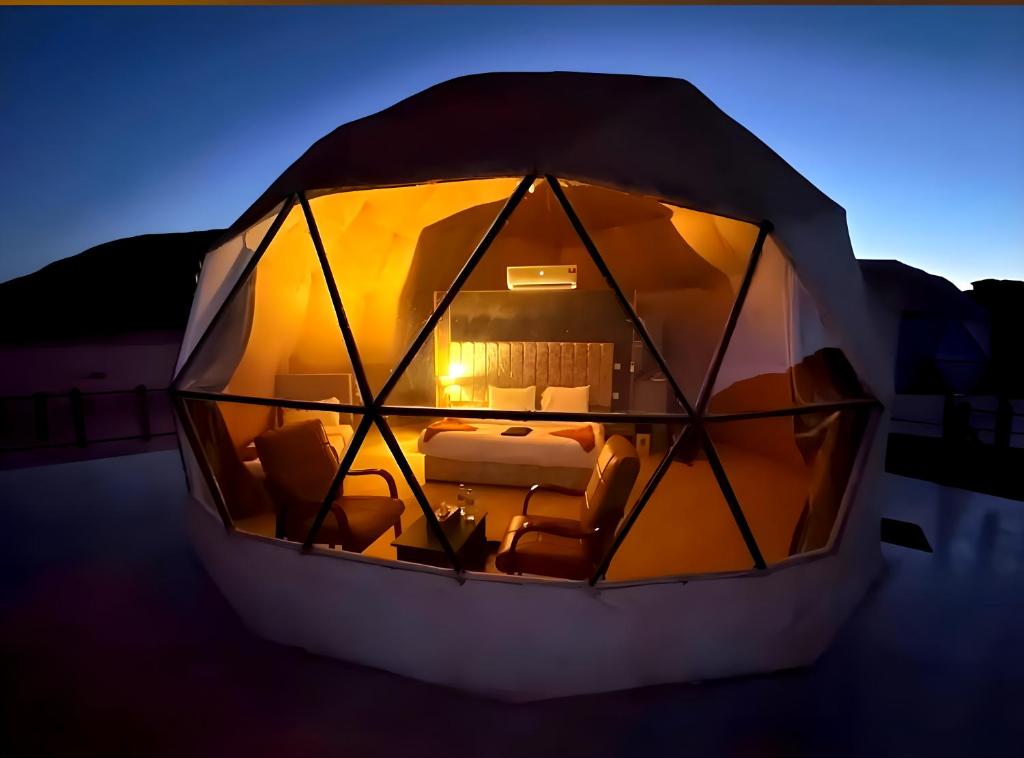 a room in a dome with a bed in it at Desert Front camp in Aqaba