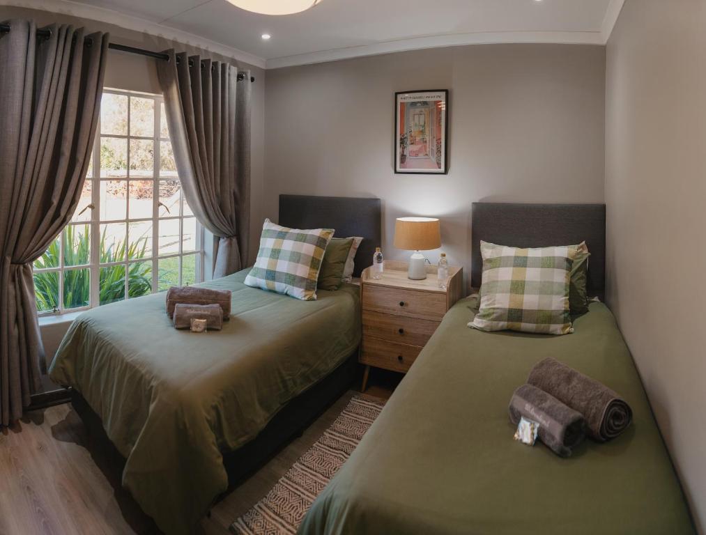 Ένα ή περισσότερα κρεβάτια σε δωμάτιο στο Welverdiend - Unit 2