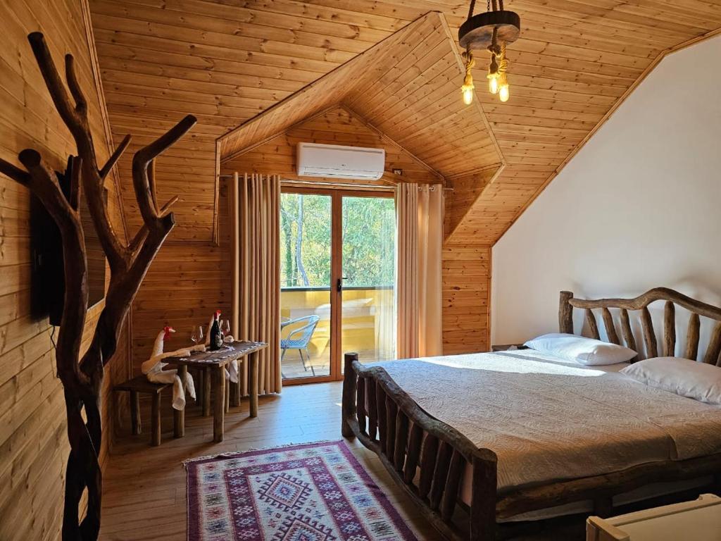 Postel nebo postele na pokoji v ubytování Bujtina Guri Hanit