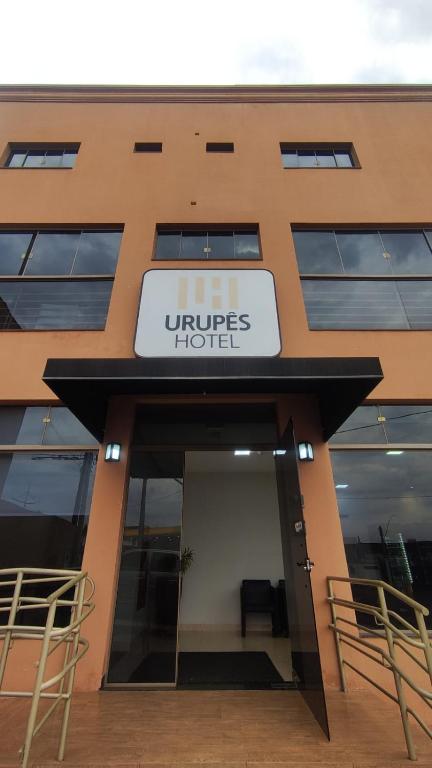 a building with a sign that reads litres hotel at Hotel Salvalagio Urupês in Urupês