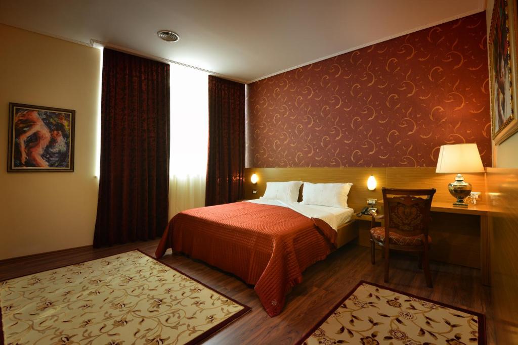 Postel nebo postele na pokoji v ubytování Hotel Austria
