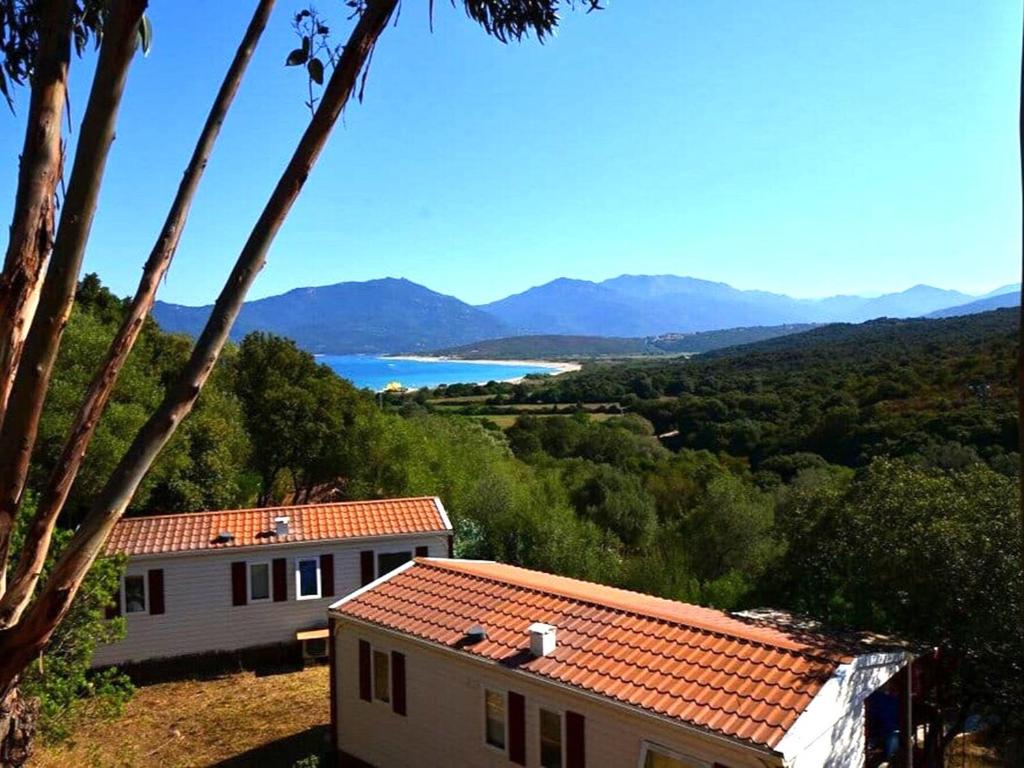 a house with a view of a lake and mountains at Mira Monti Location in Belvédère