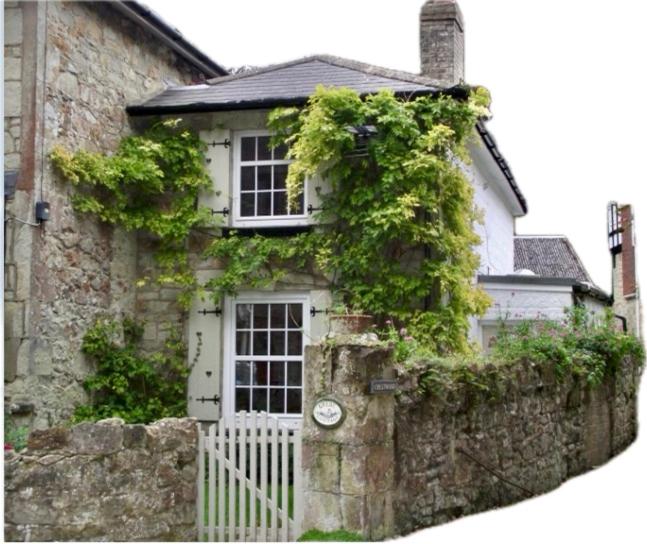 a house with a white gate and a stone wall at Grebe Cottage in Isle of Wight