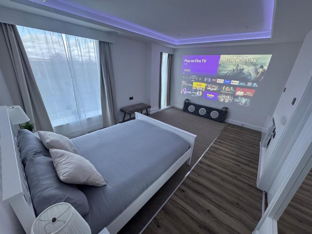 En eller flere senge i et værelse på Cinema room apartment 1