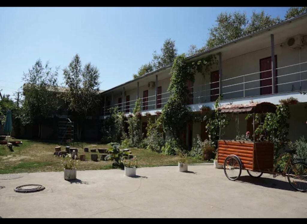 a building with a bike parked in front of it at Золотий Якор in Gribovka