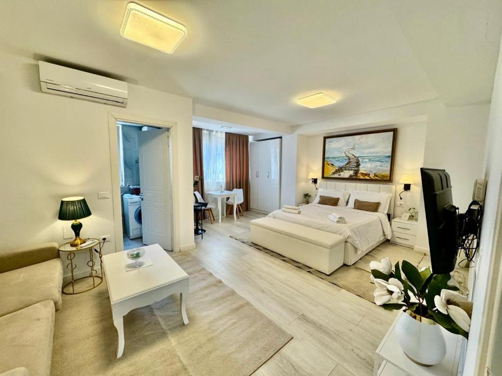 Ένα ή περισσότερα κρεβάτια σε δωμάτιο στο Wilson Garden view Tirana