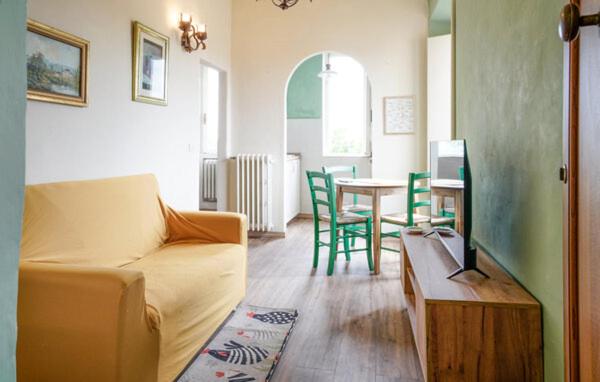 a living room with a couch and a table at Galletto del Chianti in Panzano