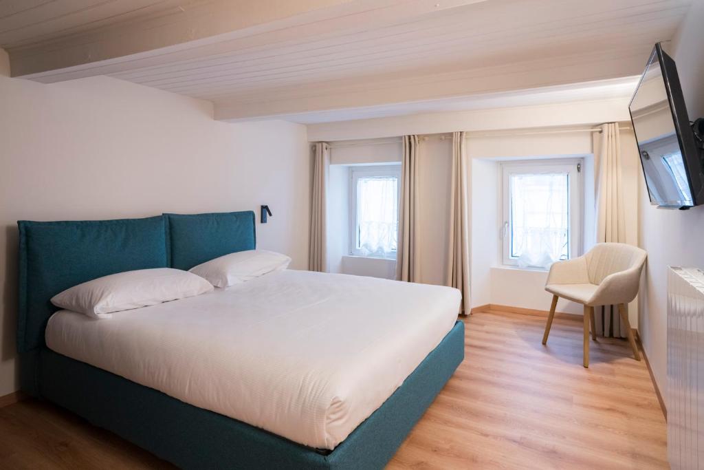 Ένα ή περισσότερα κρεβάτια σε δωμάτιο στο Aosta Holiday Apartments - Croix-de-Ville