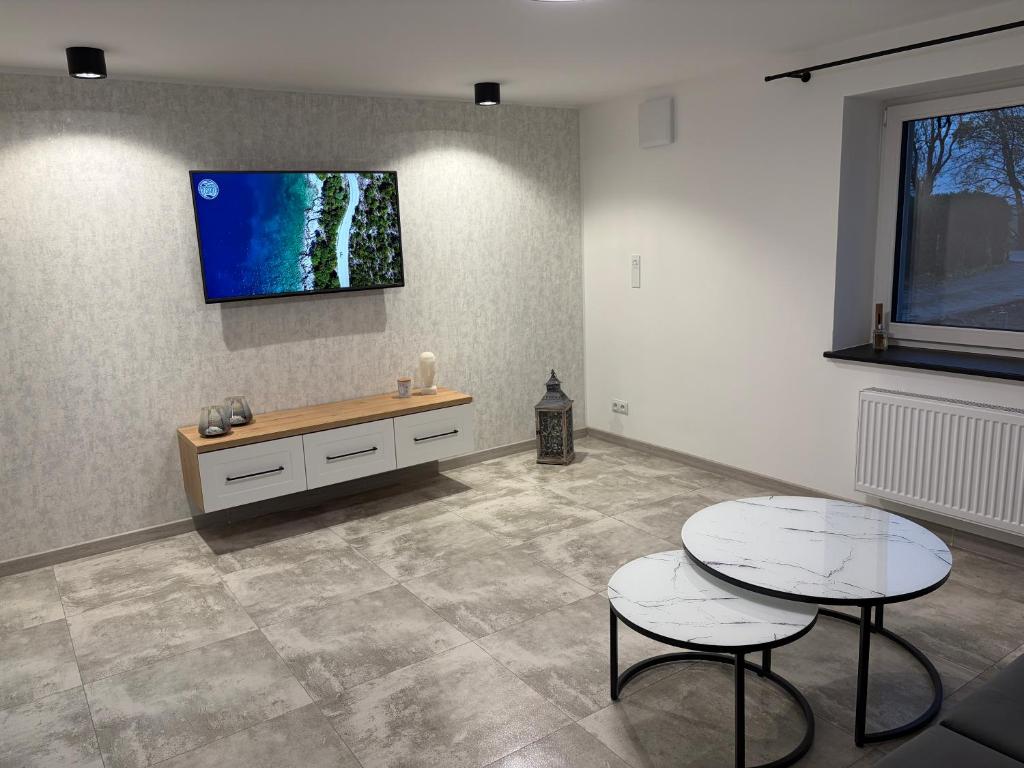 Телевизор и/или развлекательный центр в Piękna Góra House