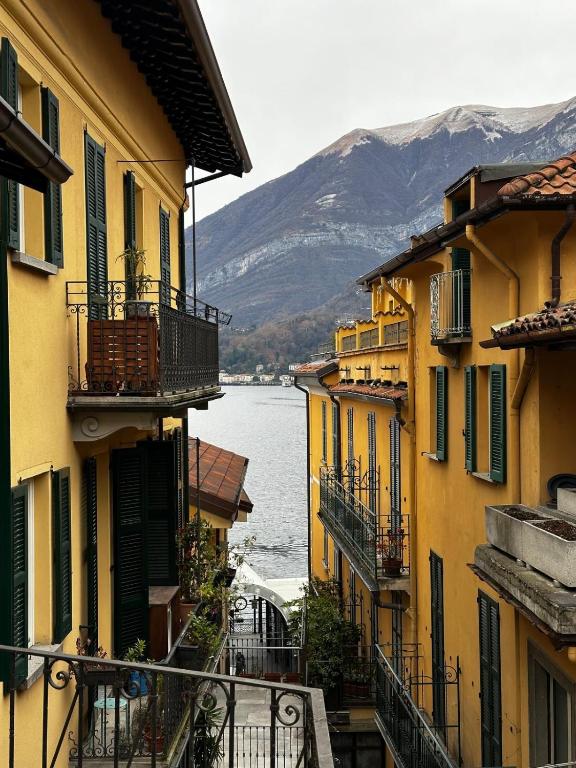 a group of buildings with a view of a body of water at SalitaCentrale6 in Bellagio