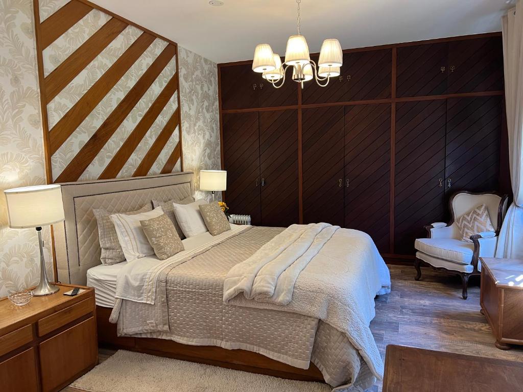 En eller flere senge i et værelse på Casa Holanda - luxury guesthouse