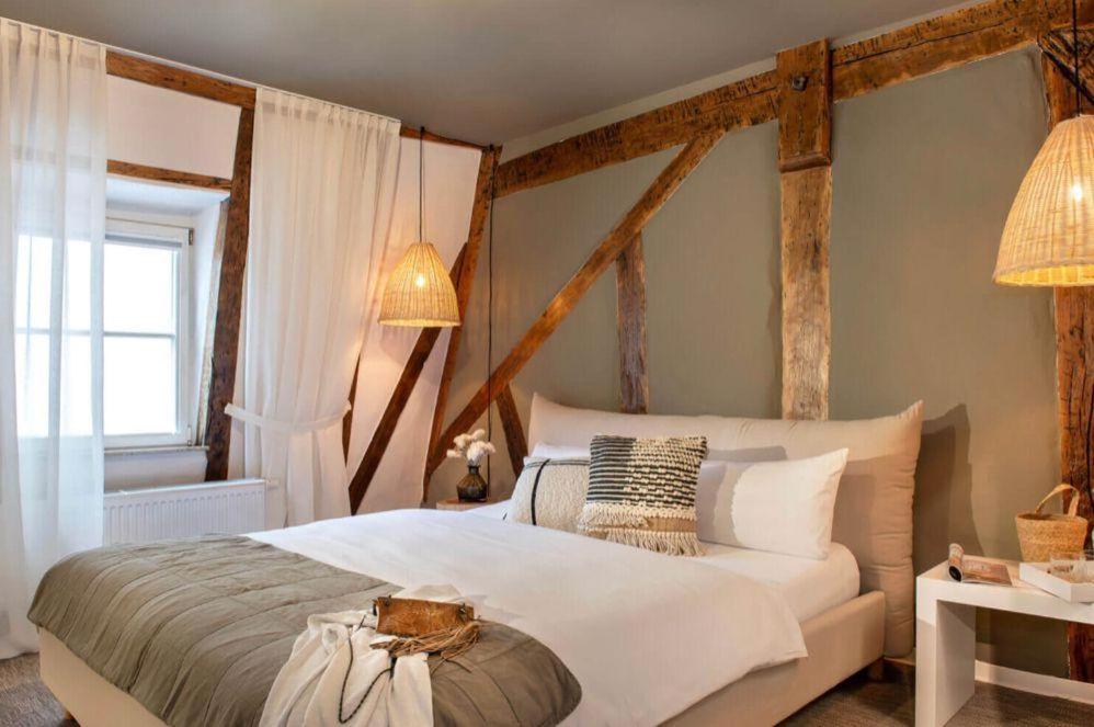 Ένα ή περισσότερα κρεβάτια σε δωμάτιο στο Hotel Fuchs Saarbrücken