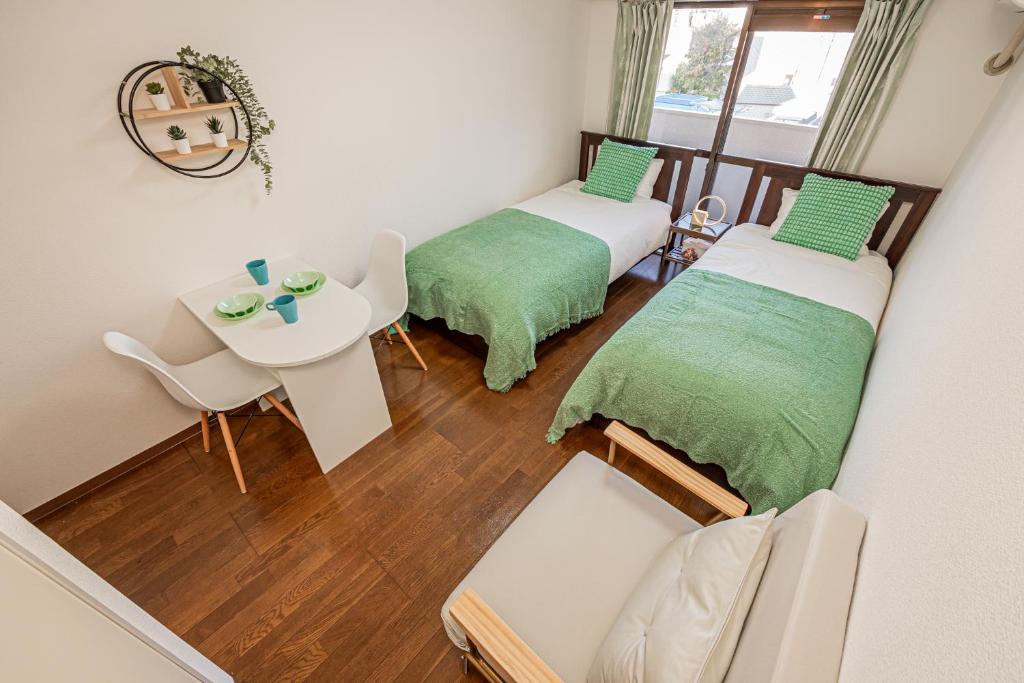 Ένα ή περισσότερα κρεβάτια σε δωμάτιο στο sakura 203