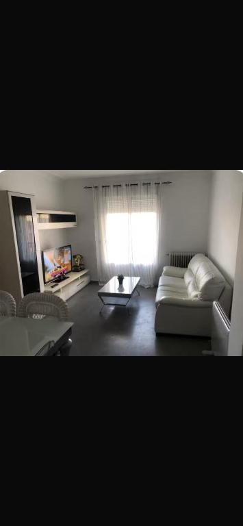 a living room with a couch and a table at coparelia 2 in Villarrobledo
