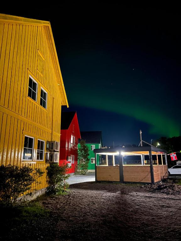 an image of the aurora dancing in the sky at Martini Fishing Camp in Lauvsnes