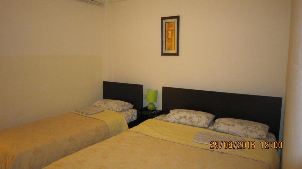 Postel nebo postele na pokoji v ubytování Filia Apartments