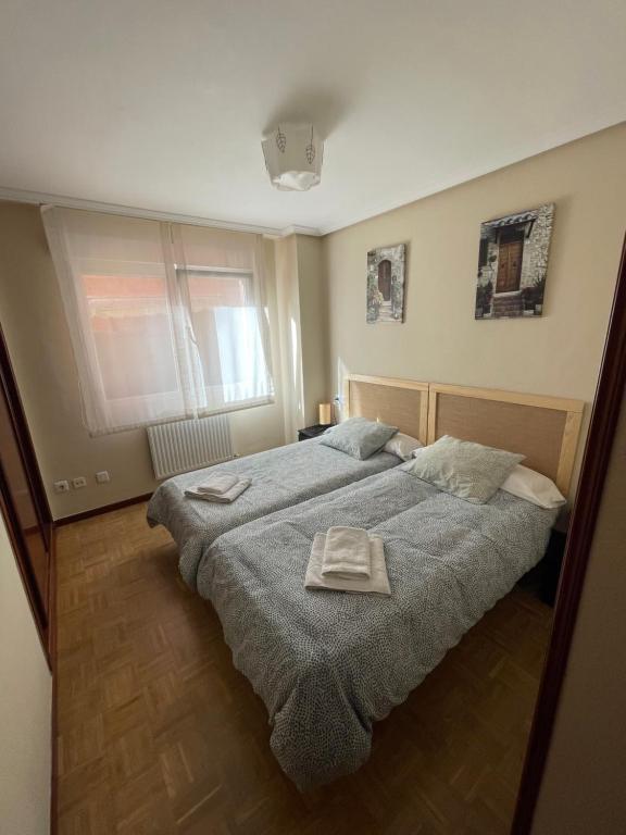 Кровать или кровати в номере Vivienda vacacional cuatrocaminos