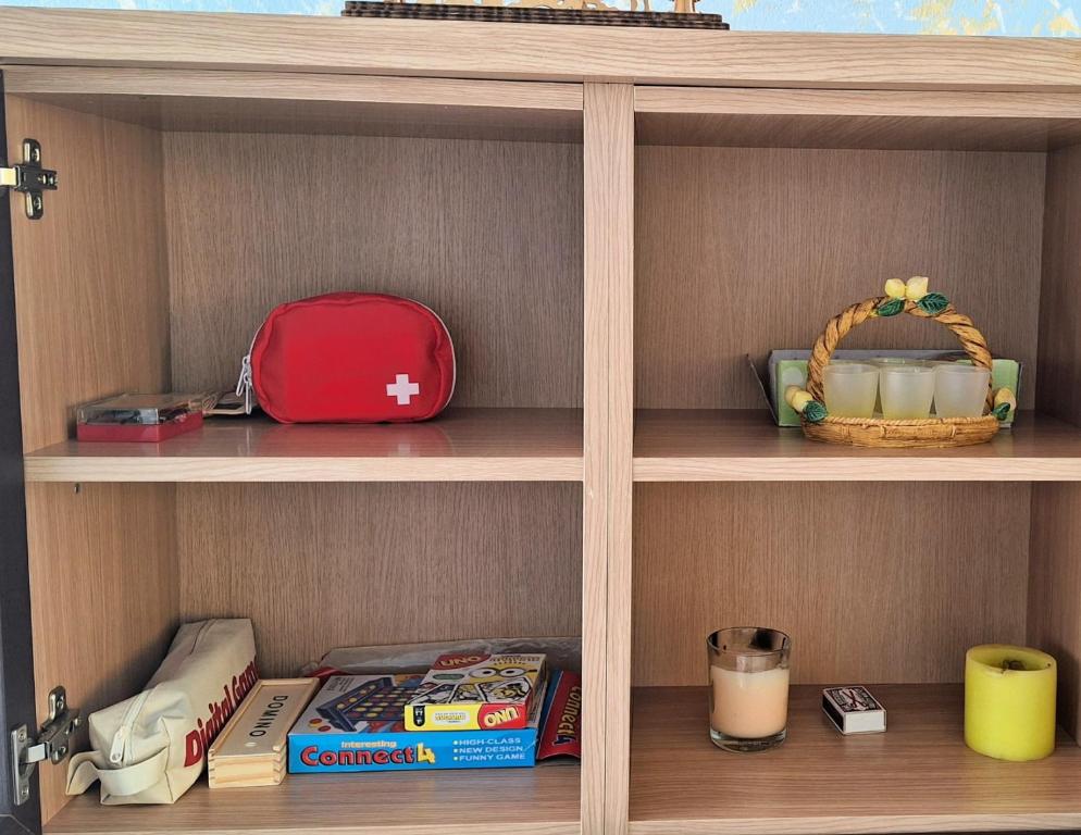 a book shelf with food and other items on it at Apartamento La Aldea Pueblo Gran Canaria 2B in La Aldea de San Nicolas
