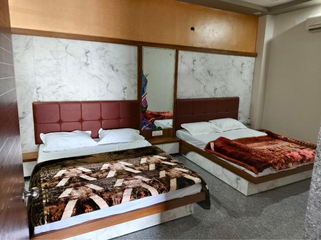 Postel nebo postele na pokoji v ubytování JD Bro Inn Hotel