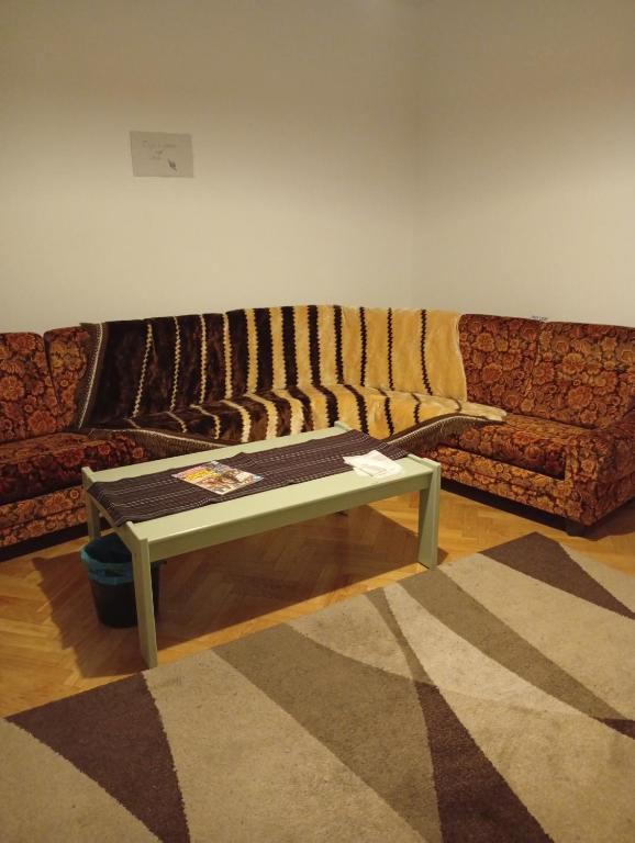 a living room with a couch and a table at B&BAnjanaS in Vaggeryd