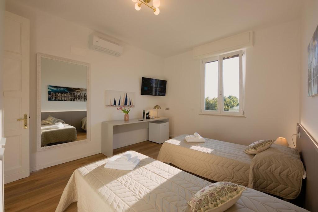 Postel nebo postele na pokoji v ubytování Camera Rio - La Casa di Carta Affittacamere