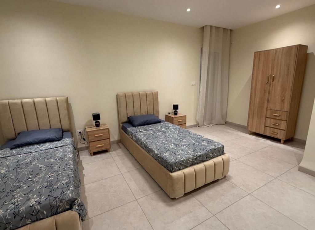 Ένα ή περισσότερα κρεβάτια σε δωμάτιο στο la bella cita fes