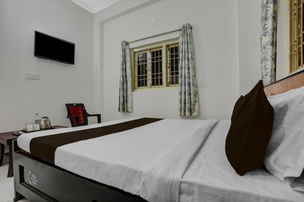 Giường trong phòng chung tại Hotel O K K Guest House