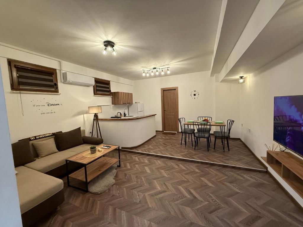 a living room with a couch and a table at Hypogeon Residence in Bitola