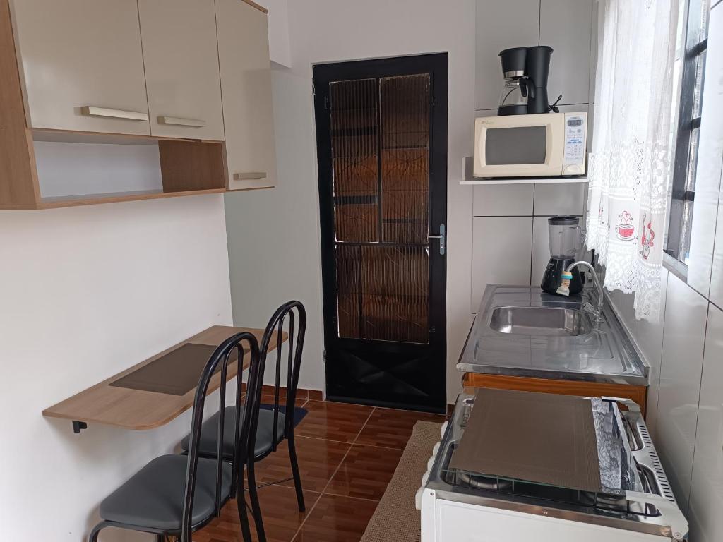 Kuchyň nebo kuchyňský kout v ubytování Aconchego,casa da Su