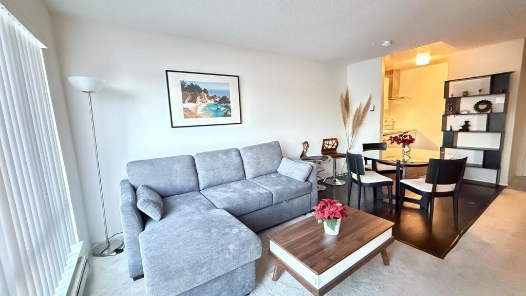 a living room with a couch and a table at Waterfront Apartment Minutes to San Francisco in Emeryville