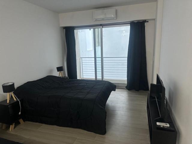 Ένα ή περισσότερα κρεβάτια σε δωμάτιο στο Suipacha Boutique