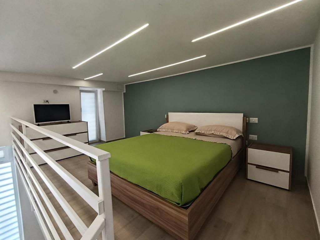 a bedroom with a bed and a television in it at AparthouseRisorgimento BORBONE in Frattamaggiore
