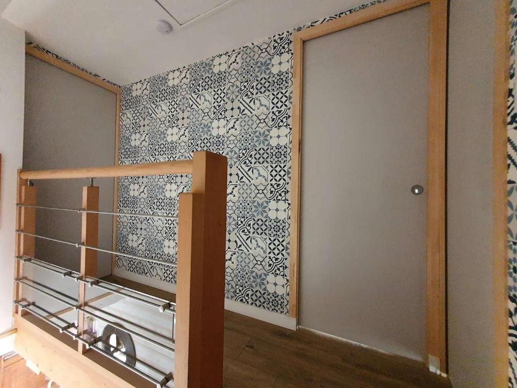 Postel nebo postele na pokoji v ubytování Penty bigouden 18ème classé 2** jardin en ville