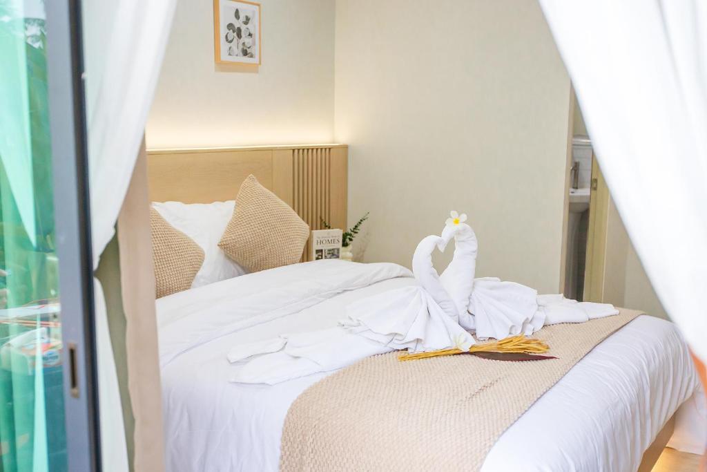 Postel nebo postele na pokoji v ubytování Triple Dreams Resort