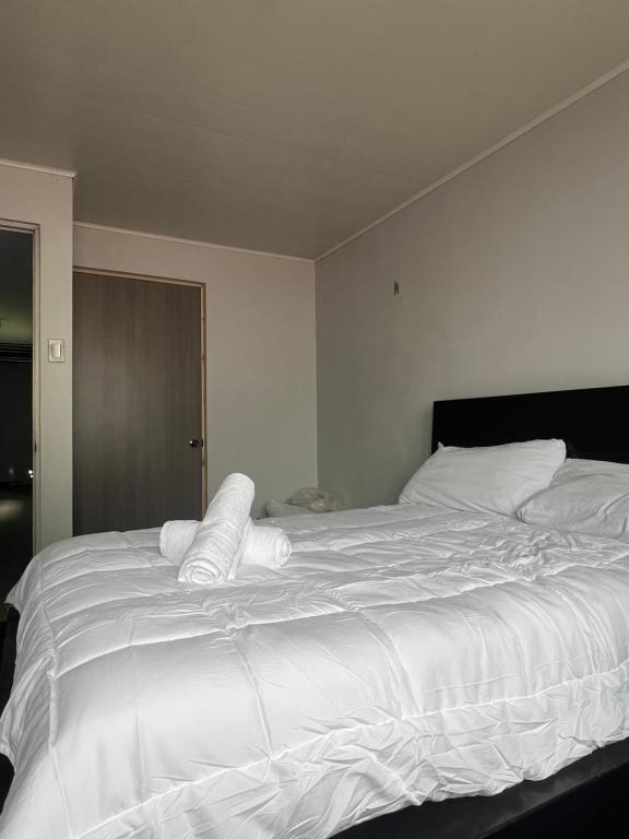 Ένα ή περισσότερα κρεβάτια σε δωμάτιο στο Aloha Sleep Inn